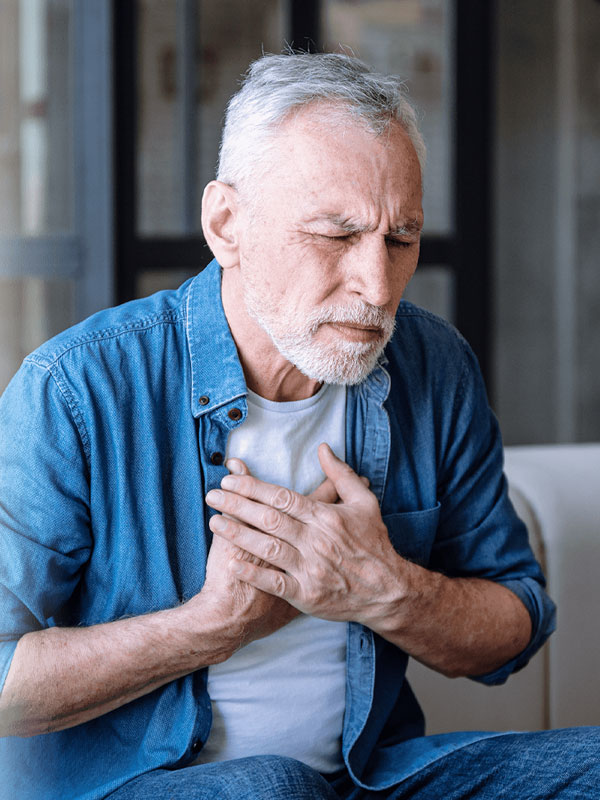 Man clutching chest wondering, Could I have NTM lung disease?